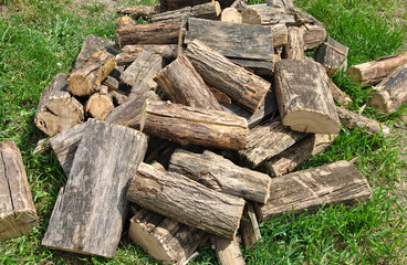 pile of wood for a fire on green grass