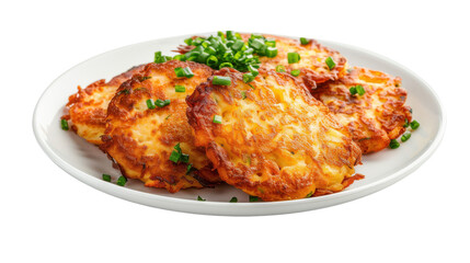 Crispy golden potato pancakes garnished with fresh green onions on a white plate