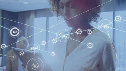 Woman tapping tablet and activating glowing shopping cart network for visualizing commerce data - Powered by Adobe