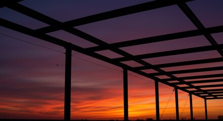 Obraz premium Sunset Silhouette: Metal Structure and Colorful Sky, Photographic Art.