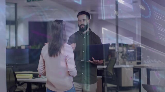 Male colleague raising laptop and showing business map and graphs while woman questioning insights