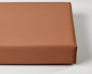 Smooth orange surface creating a warm and minimalist background