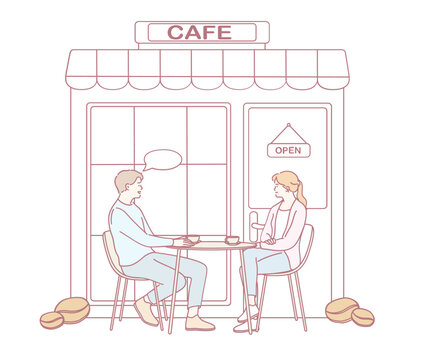 A relaxed and cozy scene featuring two people engaging in conversation while enjoying coffee at a charming cafe