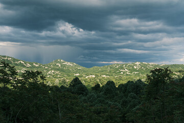 Incredible mountain landscape with mysterious dark sky before rain