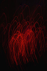 Abstract long exposure photography of red light trails