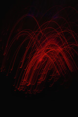 Abstract long exposure photography of red light trails