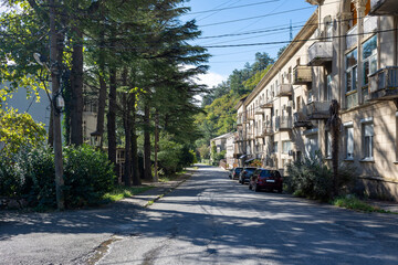 Fototapeta premium There is a small resort town on the Black Sea coast. Early in the autumn morning, the streets of the town are shrouded in tranquility. Picturesque streets, washed by sunlight,