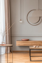 Modern minimalistic interior design featuring wooden furniture and neutral colors