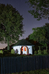 Chapel lit by candles in the night
