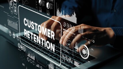 Hands typing on laptop keyboard with overlay graphics related to customer retention and analytics in a modern office setting. Asymptotic smart data analytic.