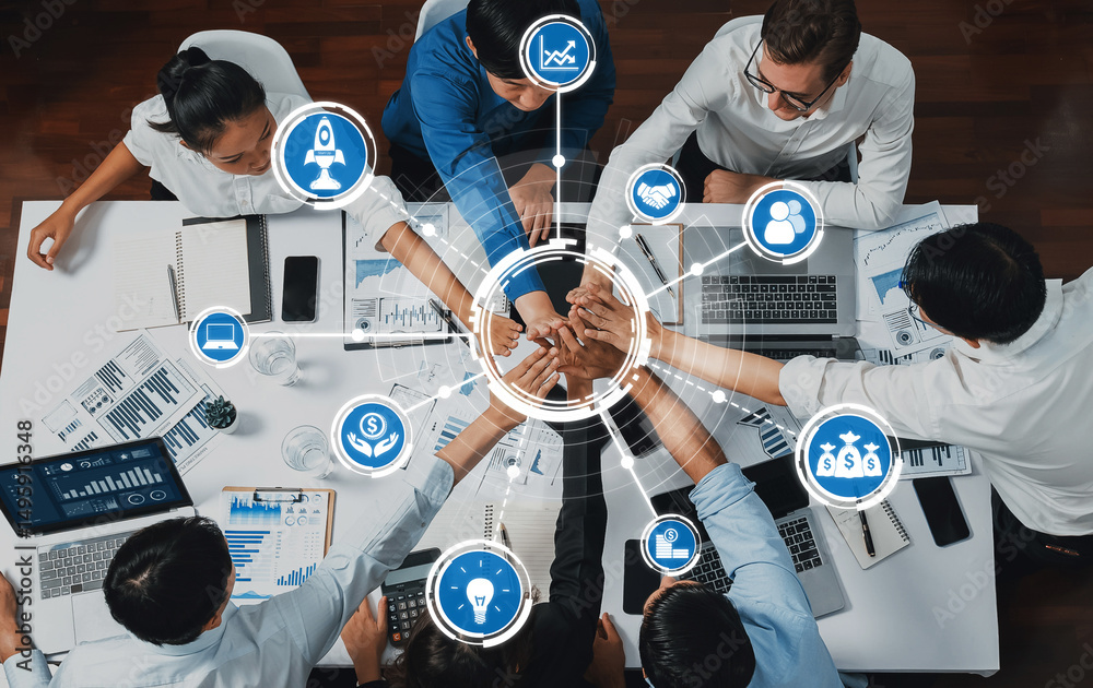 Leinwandbilder top view diverse office worker join hand together in office room symbolize business synergy and stro