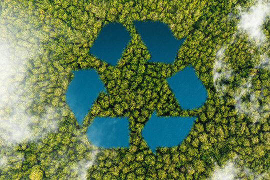 Recycled signage concept amidst the natural beauty of the natural environment. Ecological metaphor for ecological waste management and sustainable and frugal lifestyles. Recycle symbol lake.