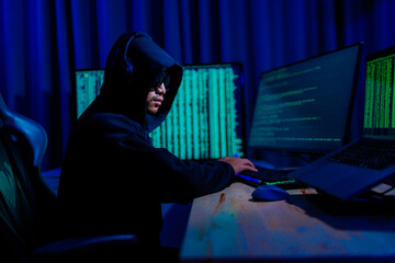 Hacker working in a dark room, deeply focused on hacking activities, surrounded by glowing screens...