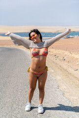 Tourist enjoying freedom and happiness on paracas beach, peru