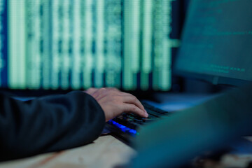 A hacker actively attempts to breach systems and steal sensitive data, representing cybercrime and...