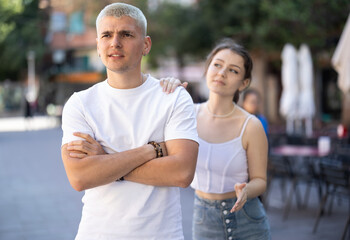 Young girl squabble with partner about jealousy. Husband and wife quarrel during walk, make...