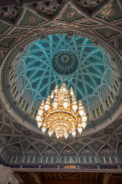 Majestic interior dome of Sultan Qaboos Mosque in Muscat, Oman