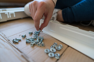 Assembling a white desk at home
