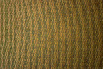 Close-up of a rustic woven fabric with natural fibers and visible texture in earth tones.Ideal for use in home decor mockups, vintage-inspired graphics, or craft design