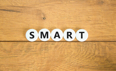 Smart symbol. Concept word Smart on beautiful white pills circles. Beautiful wooden table wooden background. Business lifestyle smart concept. Copy space.