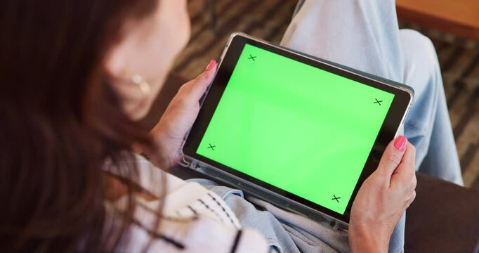 Above, woman and tablet with green screen at house for streaming online, funny video and entertainment. Person, laughing and mockup space with tracking markers, watching film and website subscription