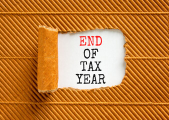 End of tax year symbol. Concept words phrase End of tax year on beautiful white paper. Beautiful...
