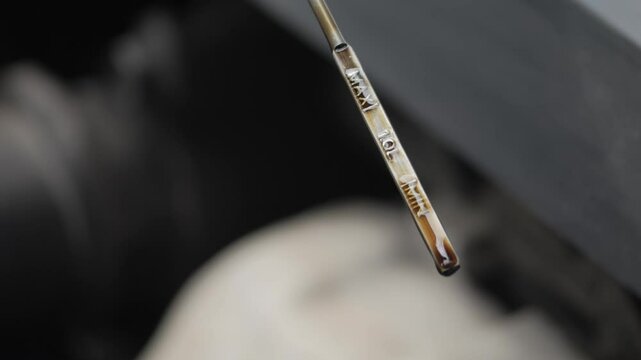 Verifying the Engine Oil Level Using a Dipstick Tool for Accurate Maintenance and Performance