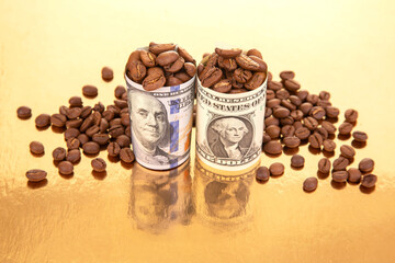 A rolled U.S. one-dollar bill filled with coffee beans stands on a reflective gold surface, surrounded by scattered coffee beans, symbolizing value and trade © photosaint