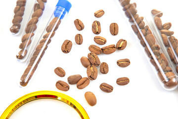 Scientific coffee inspection concept with roasted beans, test tubes, magnifying glass, and tweezers on a white background