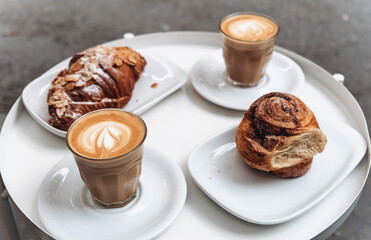 Meeting with friends over a cup of coffee with fresh buns