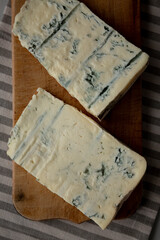 Blue cheese Gorgonzola on a Wooden Board, top view.