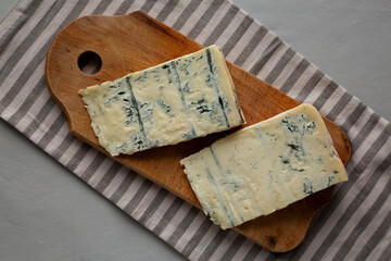Blue cheese Gorgonzola on a Wooden Board, top view.