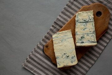 Blue cheese Gorgonzola on a Wooden Board, top view. Space for text.