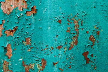 peeling blue paint on rusty metal