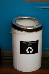 A paper recycling container in a university building.
