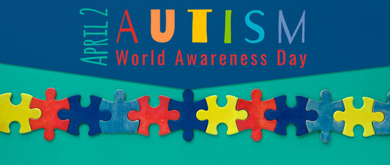 Autism World Awareness Day with colorful puzzle pieces and text 