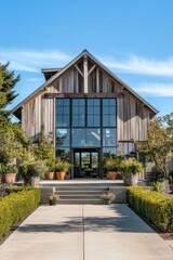Experience the charm of a stunning rustic barn house that features expansive windows and a beautifully landscaped garden, all illuminated by the warm glow of bright sunlight