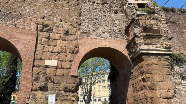 Ancient gate in Rome&rsquo;s Aurelian Walls. Historic stone archway serving as an entrance to the city&rsquo;s defensive walls, showcasing Roman military architecture.

