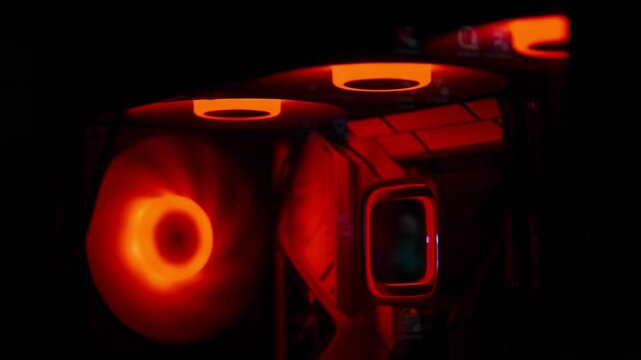 Vibrant Red RGB Lights Illuminate Inside High-Performance Gaming PC Tower in Dark Room Ambience