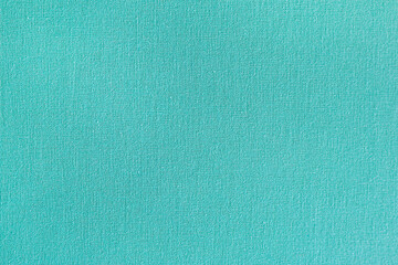 Fototapeta premium Turquoise fabric texture with subtle thread detail in a soft material finish