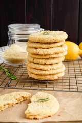 Rosemary-Lemon Sugar Cookies Stacked on a Wire Rack: Side view of stacked of freshly baked homemade sugar cookies on a wire cooling rack