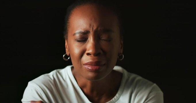 Crying, mental health and woman in studio sad for trauma, emotional abuse and bipolar disorder. Psychology, facial expression and person with anxiety, depression and stress on black background