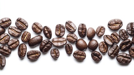 Fototapeta premium Roasted coffee beans close-up on white background with room for text.