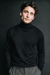 Obraz premium A handsome fashion model is the subject of a lovely portrait with a gray background