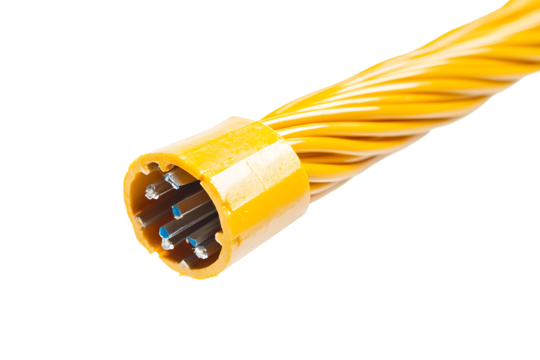 Close up of a yellow electrical cable with exposed wires against a black background space for text