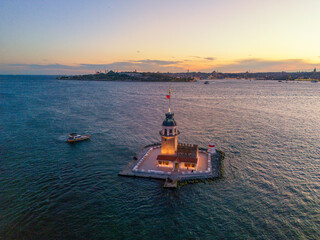 KIZ KULESI Aerial View of the Maiden's Tower at Sunset in Istanbul. A stunning aerial shot of the Maiden Tower (Kiz Kulesi) in Istanbul, Bosphorus Turkey, at sunset.Beautiful colorful sky sunrise tour