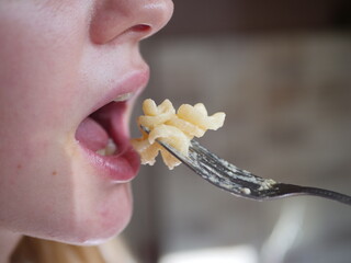 Closse up of girl mouth eating food