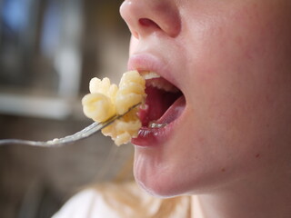 Closse up of girl mouth eating food