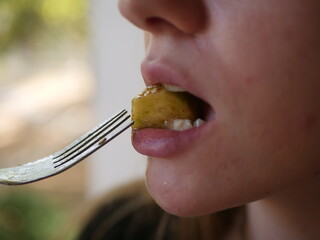Closse up of girl mouth eating food