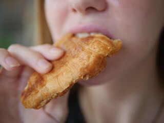 Closse up of girl mouth eating food